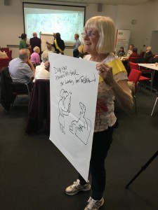 Lesley Calvert, former district nurse from Salford with her personalised nurse cartoon by Tony Husband