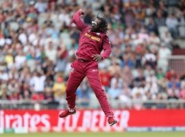 West Indies Chris Gayle celebrates taking the wicket of New Zealand's Ross Taylor during the ICC Cricket World Cup group stage match at Old Trafford, Manchester.