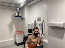 Sarah pictured in Salford Royal's changing place. 
(Credit: Sarah Rennie)