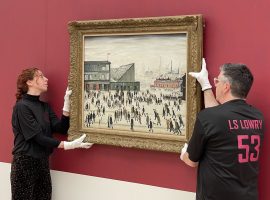 'Going to the Match' being rehung by The Lowry's staff