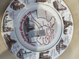 A commemorative plate that details all of Salford's former coal mines (own image).