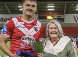 Shirley Bradshaw with Red Devils prop Ollie Partington.