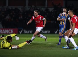 Salford City's Adam Rooney celebrates scoring his side's first goal of the game during the Emirates FA Cup, first round replay match at the Peninsula Stadium, Salford.