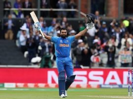 India's Rohit Sharma celebrates reaching his century during the ICC Cricket World Cup group stage match at Emirates Old Trafford, Manchester.