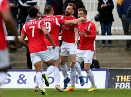 Salford City's Adam Rooney is congratulated by Salford City's Danny Lloyd after opening the scoring during the Vanarama National League match at the Super 6 Stadium, Hartlepool.