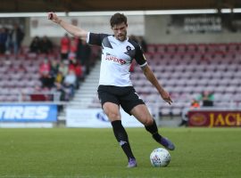 Defender Cameron Burgess in action vs Northampton Town. (Credit: Salford City - Charlotte Tattersall)