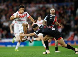 St Helens' Regan Grace is tackle by Salford Red Devils' Niall Evalds during the Betfred Super League Grand Final at Old Trafford, Manchester.