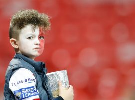 Image Credit: PA Images. A St Helens fan in the stands