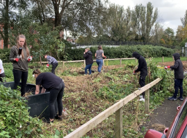 Young volunteers of the Prince's Trust clearing the land