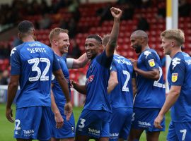 Defender Ibou Touray congratulated by his teammates. Credit: Charlotte Tattersall - Salford City