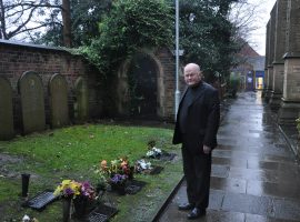 Fr. Sheehy next to St. Peter's cemetery. credit: Yann Robinson