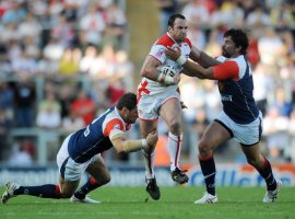 England's Adrian Morley is tackled by France's David Ferriol (left) and Michael Simon during the international match at Leigh Sports Village, Manchester. Credit: PA Images