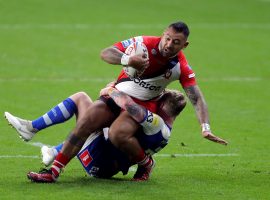 Salford Red Devils Krisnan Inu is tackled by St Helens Tom Nisbet during the Betfred Super League match at the Emerald Headingley Stadium, Leeds.