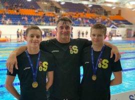 John (centre) with National Champions Max Adams and Joe Stout