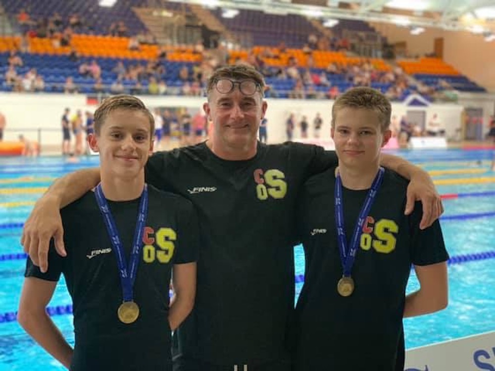 John (centre) with National Champions Max Adams and Joe Stout