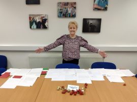 Shirley Cunningham distributing letters from pupils, Credit: Age UK Salford