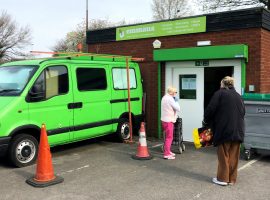 Members queue at Lucie's Pantry social supermarket