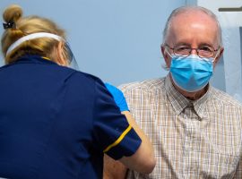 © Joel Goodman - 07973 332324 - all rights reserved. For NHS Internal Comms use . 08/12/2020. Salford, UK. TED JONES  ( Frederick Jones ) is the first to be vaccinated . The first to receive the Coronavirus vaccine at Salford Royal (formerly Hope ) Hospital . The Pfizer / BioNTec Covid-19 vaccine is being administered to patients around the UK from today ( 8th December 2020).  . Photo credit : Joel Goodman