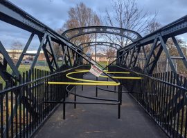 Barrier between Peel Park and River Irwell