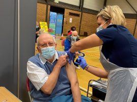 Peter Roberts receiving his first vaccine on December 16th. (Image:  Salford CCG)