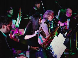 Adina Nelu playing the flute in group AMCG. Photo credit: Joe Stevenson. Permission for use from Adina Nelu