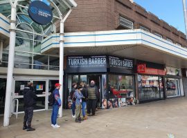 Queues for haircuts at Salford Shopping City on Monday. Copyright Marcus Smith