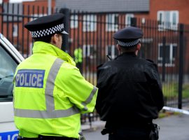 C8C67P Policeman at the scene of a shooting incident in Salford, Greater Manchester, England. Sunday October 09, 2011. Image credit: Alamy