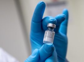 Army Spc. Angel Laureano holds a vial of the COVID-19 vaccine, Walter Reed National Military Medical Center, Bethesda, Md., Dec. 14, 2020. (DoD photo by Lisa Ferdinando)