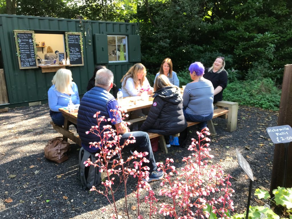 People relaxing Cleavley Community Forest Garden cafe Permission to use from Ian Bocock