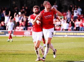 Goalscorer Matt Smith shushing the Walsall Town fans after his goal