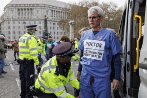 David McKelvey being arrested on Lambeth Bridge