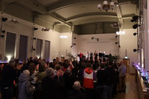 A standing ovation in Eccles Town Hall with Maxine Peake, Jennifer Reid, Roystone Futter, Oliver Lomax, Christopher Eccleston and James Quinn on stage.