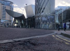 A pothole in front of the Lowry Theatre. Image by Harry Warner