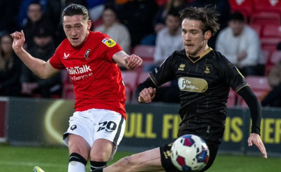 Louie Barry strikes (Photo from Salford City Twitter)