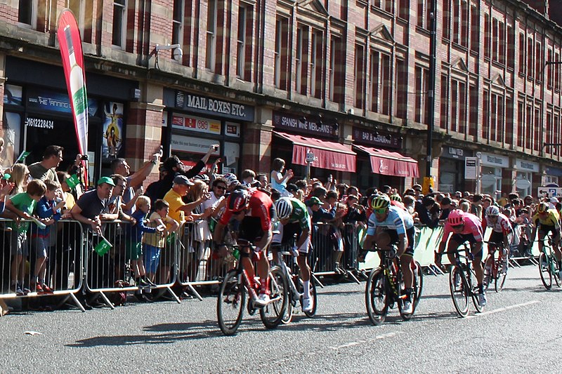 2019 Tour of Britain stage in Manchester. Credit: Wikicommons. https://commons.wikimedia.org/wiki/File:2019_ToB_stage_8_Manchester_finish_-_161_Cees_Bol_081_Mathieu_van_der_Poel_041_Matteo_Trentin_102_Sacha_Modolo_TBC_132_Jasper_de_Buyst.JPG