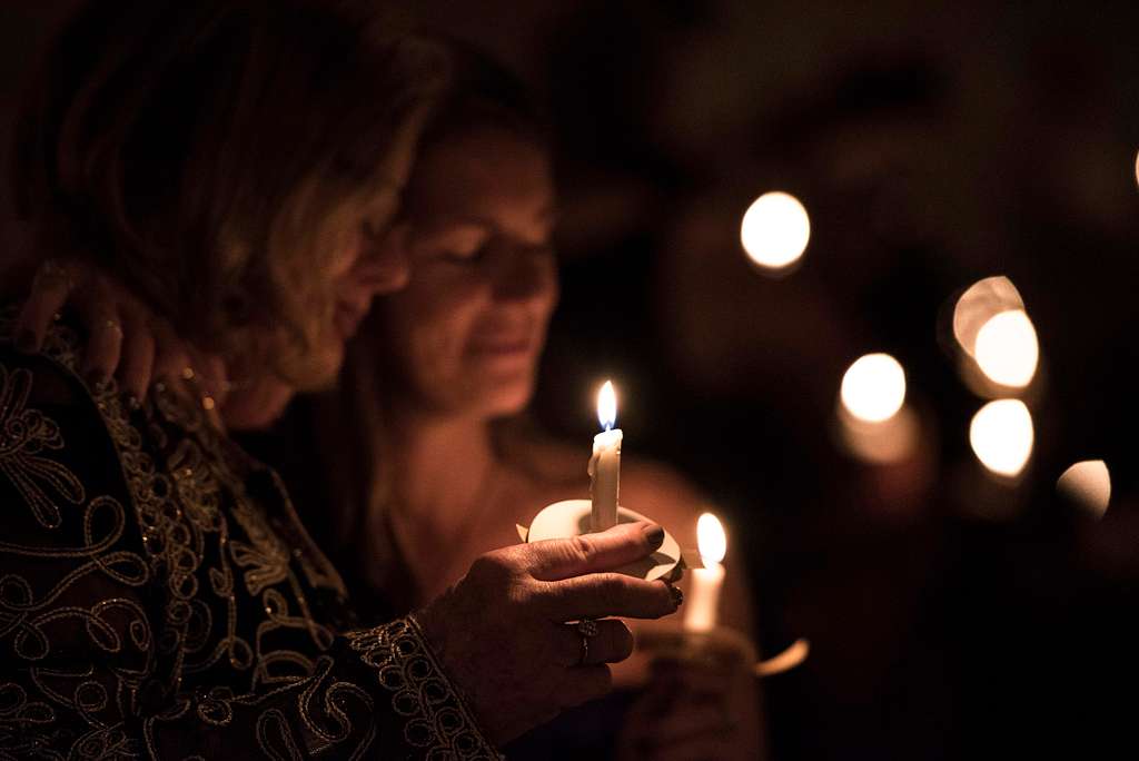 https://picryl.com/media/family-members-hold-a-candle-for-a-remembrance-ceremony-46305f