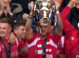 Salford City lift the National League Play-off Final trophy. Image from Salford City FC on YouTube.