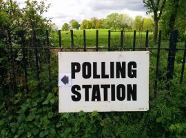 Polling station sign, credit Wikipedia commons - https://commons.wikimedia.org/wiki/File:Polling_station_sign_Hamsptead_Heath_2015.jpg