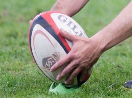 Player kicking a rugby ball