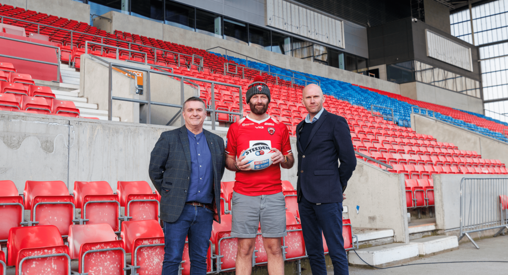 Paul Dennett Paul King and Tony Sutton holding a ball pitchsideSalford Red Devils financial