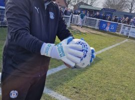 Dementia friends logo on goalkeeping gloves- image credit- Irlam FC