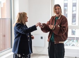 Harriette Matthews being given her key to the apartment