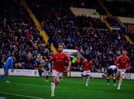 Conor McAleny celebrates after scoring against Notts County. Image Credit: Salford City