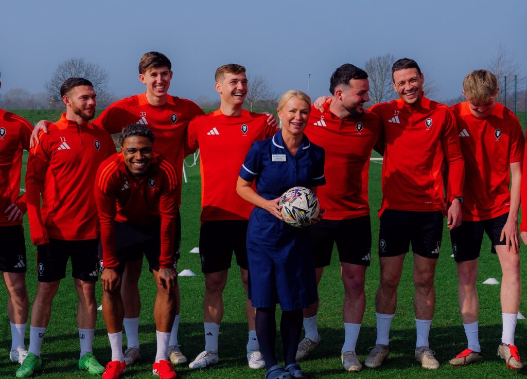 skin cancer - Salford City Football Club Players, pictured with Screening Nurse, Dawn Lisa - Copy