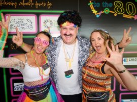 L-R Erica Beamer, Craig Howarth and Janine Jackson from Salford Loaves & Fishes join in the fun at the Back to the 80s charity disco