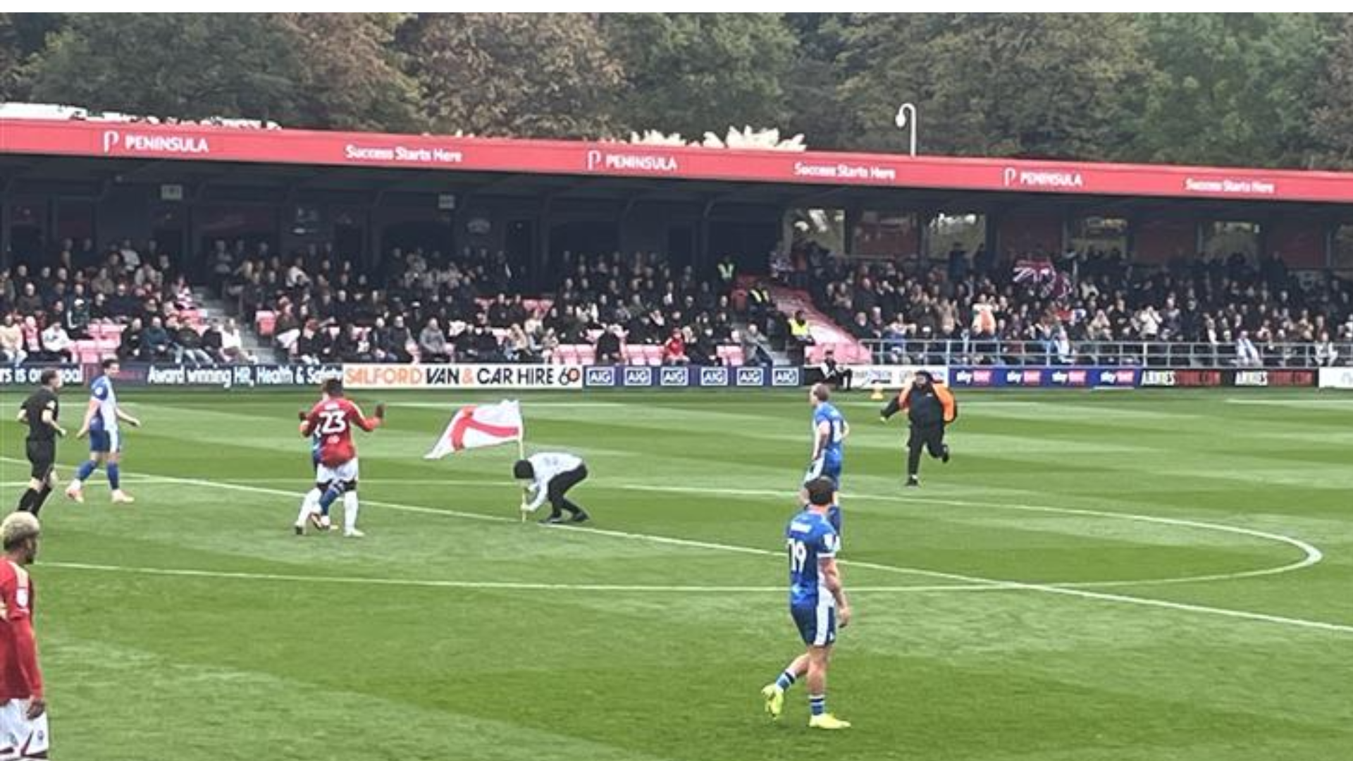 Three men charged after pitch invasion at Salford City in alleged Gary Neville protest