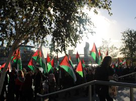 Pro-Palestine protestors marching through Media City