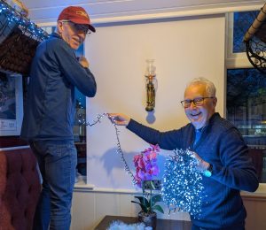 The team at FIRST putting the Christmas decorations up at Irlam Station (Joan Ollerenshaw, 2025)