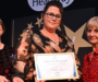 Woman hailed as “backbone” of Salford brain injury charity wins award